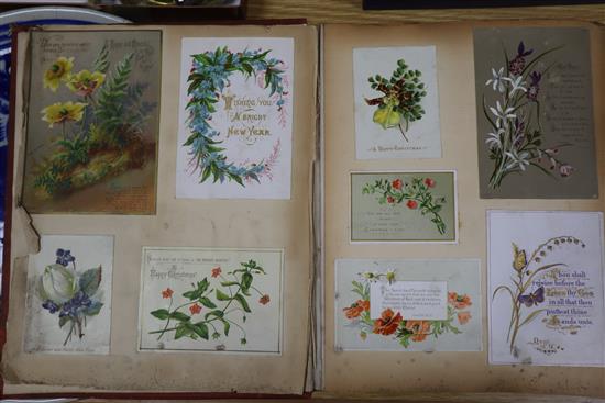 A photograph album and an album of 19th century and later greetings cards and postcards